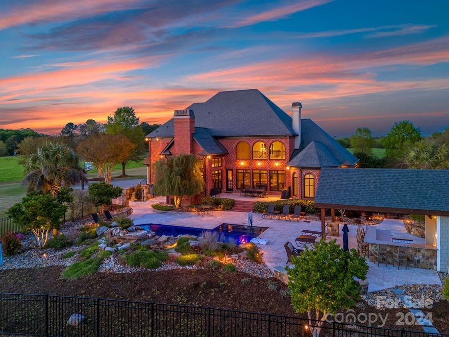 Welcome to your private oasis nestled on 17 acres of serene countryside! This custom-built, full brick home boasts luxury and tranquility at every turn. Step into the two-story living room, flooded with natural light, creating an inviting atmosphere perfect for gatherings by the fireplace. The main level features a spacious primary suite and an open floor plan. Retreat to the basement for movie nights in the theater room for a cinematic experience, along with a gym and den area. Outside, discover your own slice of paradise with an oasis-style backyard, with an outdoor cabana and bar, ideal for entertaining guests. Enjoy the full sand volleyball court that is illuminated for evening play. Plenty of room to spare on the expansive property, there's potential for development, whether you envision adding more recreational amenities or simply embracing the natural beauty of the surroundings. Experience the ultimate in privacy and tranquility in this stunning two-story basement home!