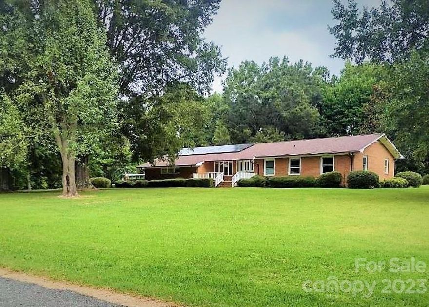 Looking for privacy, 4 acres, over 500 ft of road frontage, a workshop and no city taxes? Look no further! This ranch home is located on a very private road which ends at the proposed oakdale park property. The home features a great room, spacious kitchen with an abundance of cabinet and storage space and breakfast area with solid surface countertops.The property also has a workshop with power. The oversized two car garage is 700 sf and has numerous storage cabinets and an area perfect for the DIY projects.The entire home inside and out has been freshly painted, hardwood floors have just been refinished brand new carpet in home, neutral colors, and so much more. This home is conveniently located to I-485 and is an easy commute to airport and uptown. Come and see this amazing opportunity! 100% FINIANCING AVAILABLE FOR QUALIFIED BUYERS. CALL FOR DETAILS.