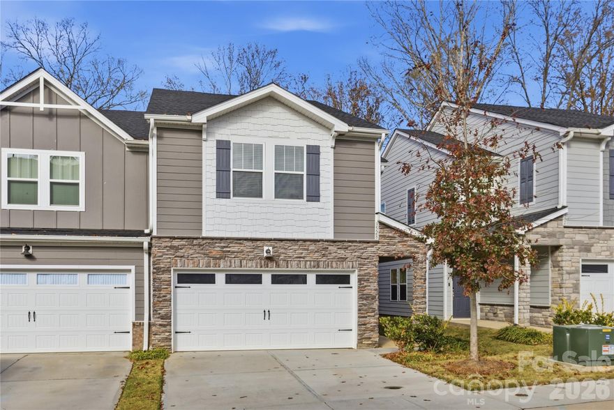 Welcome to 3528 Auburn Curb Road! This desirable end-unit townhome is located in the charming Enclave at City Park community—just minutes from the CLT Regional Farmers Market, Charlotte Douglas Airport, South End, and Uptown. Thoughtfully upgraded beyond standard builder finishes, this residence showcases stylish, custom touches throughout. The kitchen is a true culinary highlight, complete with an oversized island, large pantry, and stainless-steel appliances. Its open-concept layout offers generous space for entertaining as well as comfortable everyday living. Step outside to enjoy a patio with peaceful wooded views. Upstairs, the spacious primary suite features a luxurious en-suite bath with double sinks, a tiled shower, and a walk-in closet. Two additional bedrooms, a full bathroom, a versatile loft area, and a laundry room complete the upper level.
