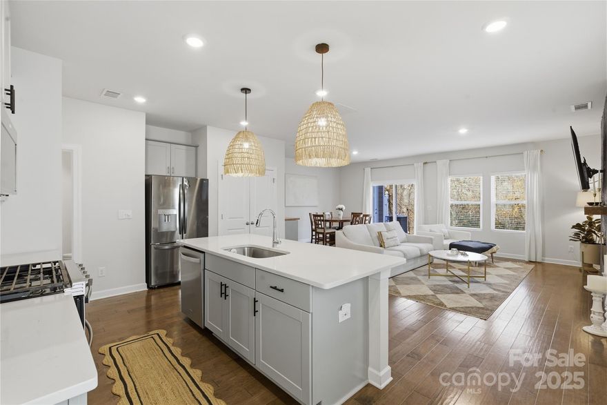 Welcome to 3528 Auburn Curb Road! This desirable end-unit townhome is located in the charming Enclave at City Park community—just minutes from the CLT Regional Farmers Market, Charlotte Douglas Airport, South End, and Uptown. Thoughtfully upgraded beyond standard builder finishes, this residence showcases stylish, custom touches throughout. The kitchen is a true culinary highlight, complete with an oversized island, large pantry, and stainless-steel appliances. Its open-concept layout offers generous space for entertaining as well as comfortable everyday living. Step outside to enjoy a patio with peaceful wooded views. Upstairs, the spacious primary suite features a luxurious en-suite bath with double sinks, a tiled shower, and a walk-in closet. Two additional bedrooms, a full bathroom, a versatile loft area, and a laundry room complete the upper level.