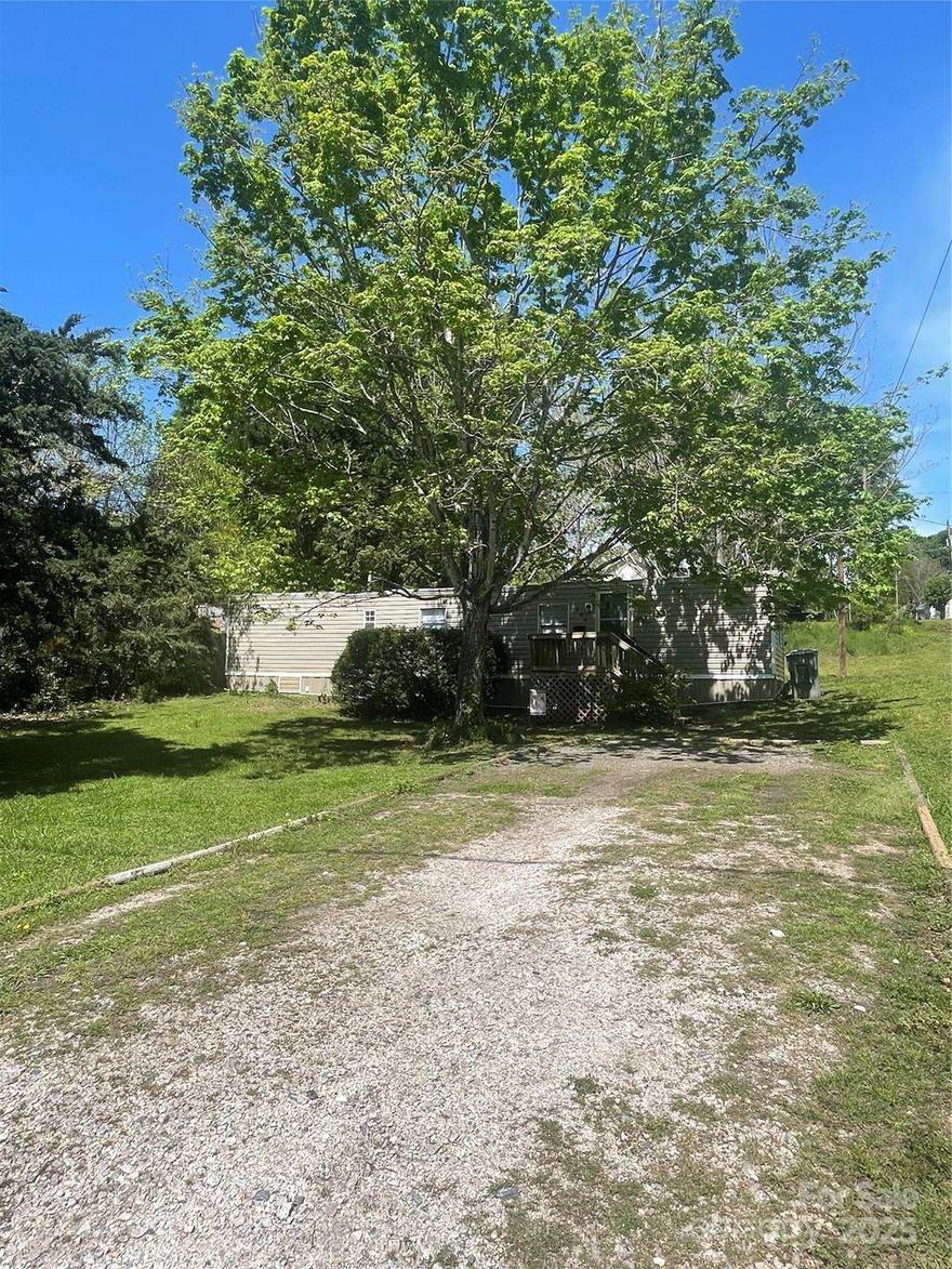 Cozy 2 bedroom/1 bath on nice in town lot with trees.  Large front and back yard. Seller just replaced the HVAC with a new heat pump.  The water heater was replaced in 2023.  Refrigerator, stove/oven and washer/dryer will remain.  Split bedroom floorplan.  Home HAS been de-titled.   Used as a rental for the past 12 years.  Close to downtown shops, restaurants, and schools.  Vacant and ready for new owner(s).  Hurry before it's gone!