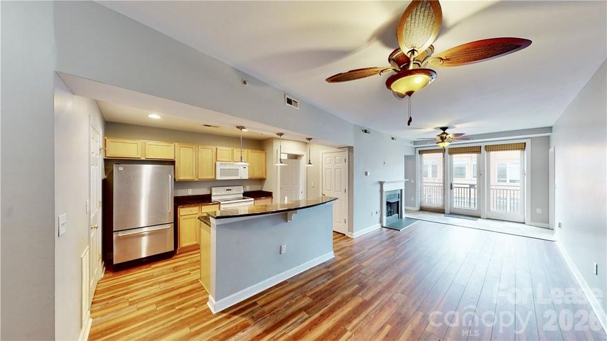 Top floor condo in Gateway Plaza!  2 bedrooms, 1 bath unit conveniently located close to many Uptown attractions!  LVP flooring throughout - NO CARPET!  Living room has cozy gas fireplace and opens up to a private balcony. Primary suite has oversized bathroom and walk in closet. Secondary bedroom has beautiful light to make for a great home office. Building amenities include common area with kitchen and roof top terrace with amazing city views.  Private pool for resident use only.  Gateway Plaza has convenient gated parking. Washer dryer included.