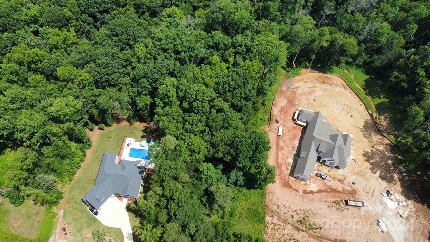 Looking for a few acres to build your next home? This 3.47 acre parcel is located in the desirable Berkshire neighborhood in Mount Ulla. Bring your builder or choose one of the builders in the neighborhood to create your perfect paradise. This property has been perked for a 3 bedroom home with a 2 bedroom guest house, has a well permit, and a survey that will be transferred at closing! All you need to do is decide your builder and plan and you can buy with confidence since the seller has done the work for you. Builder options are available, call listing agent Jeff for information on options. Land has a partial flood area in the back part but plenty of land to build on.