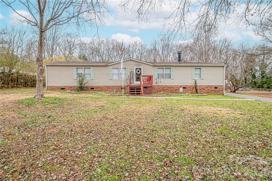 Discover your dream property! This flat-acre lot offers endless possibilities with no HOA restrictions. It features a spacious two-car detached garage wired for 110 and 220 and a versatile 16x16 wired outbuilding.

The home is designed with comfort and convenience in mind. It boasts two full bathrooms connected by a large walk-through closet in the primary suite. Recent updates include modern flooring and a refreshed kitchen, adding to its charm and functionality.

With ample space, you can build your dream home while utilizing the existing house as a rental, in-law suite, or whatever suits your vision. This property is truly a must-see!