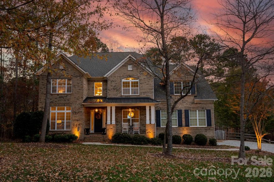 Experience elevated Lake Norman living in this breathtaking full-brick 5-bed, 4.5-bath estate, perfectly positioned at the end of a serene cul-de-sac in The Farms—one of Mooresville’s most coveted luxury communities. Set on nearly three-quarters of an acre, this home delivers an exceptional combination of privacy, sophistication, and resort-style amenities, all wrapped into an everyday lifestyle that feels like a retreat. From the moment you pull into the oversized 3-car garage and extended driveway, the setting feels peaceful, refined, and truly special. Mature trees, a deep lot, and a quiet cul-de-sac backdrop provide the ideal sense of seclusion while still being minutes to top-rated schools, Lake Norman marinas, and the area’s best shopping and dining. Inside, you’re welcomed by a flowing floor plan that prioritizes space, light, and livability. The main level primary suite offers a private escape with generous dimensions, luxury bath finishes, and serene views of the backyard. The heart of the home is the showstopping gourmet kitchen, thoughtfully designed with double islands, two-tone cabinetry, expansive prep space, and stainless-steel appliances—an entertainer’s dream and a chef’s everyday playground. With both formal and casual dining areas, a convenient home office, and an organized drop zone, the main level blends elegance with true functionality. The two-story family room steals the spotlight with its soaring ceilings, dramatic windows, and a cozy gas fireplace—creating an inviting atmosphere for gatherings of any size. Every corner of this home feels open, airy, and purposefully designed. Upstairs, the scale of the home truly shines. Every single room is impressively spacious, offering comfort, privacy, and flexibility. The upper level includes four large bedrooms, three full baths, a flexible loft/flex area, and a massive bonus room perfect for a media room, home theater, playroom, or fitness studio. Whether hosting guests, growing a family, or needing multiple work-from-home spaces, this layout adapts beautifully. Step outside to the expansive fenced backyard (installed <2 yrs ago)—a rare find at nearly 0.75 acres—offering endless possibilities. Whether you envision a pool, an outdoor kitchen, a play area, garden beds, or simply a quiet space to unwind, this yard provides both privacy and potential. The peaceful setting and tree-lined backdrop create the perfect outdoor sanctuary. Living in The Farms means enjoying a true resort-style lifestyle. The community features a beautifully designed clubhouse for social events, a large outdoor pool, tennis and pickleball courts, basketball, a soccer field, beach volleyball, walking trails, and playgrounds. It’s a community known for its vibrancy, activity, and strong neighborhood feel—an ideal place to call home. This home offers an unmatched blend of luxury, space, comfort, and lifestyle—set in one of the most desirable communities near Lake Norman. A rare opportunity to own a full-brick estate with incredible scale, timeless finishes, and a setting that truly stands out.