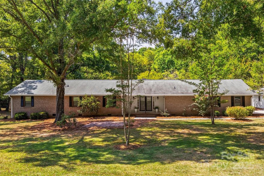 Step into this meticulously renovated spacious brick ranch on nearly 2 acres, where no detail has been overlooked. Featuring 4 spacious bedrooms, 2.5 bathrooms, and a versatile flex room ideal for a home office, playroom, or hobby space, this home offers both comfort and functionality.  You'll love all the storage throughout!  The beautiful eat-in kitchen features new cabinets and gorgeous quartz countertops with a walk-in pantry. The large living room offers plenty of space to relax or entertain with a seamless flow to one of the back decks and large yard. Owners are sure to appreciate the detached garage with electricity and the two-car attached garage with tons of storage space for all your project dreams!  Practically across from York County’s planned Catawba Bend Preserve Park, future homeowners will enjoy easy access to trails, riverfront recreation, event spaces, camping, a dog park, and more—all part of the county’s exciting master plan.  Nestled outside the city limits yet only minutes from shopping, dining, and major thoroughfares, this home combines peace and privacy with convenient access to everything. With comprehensive renovations providing peace of mind, you can move in and immediately feel at home. This is a rare opportunity to own a turnkey property in a growing area with incredible outdoor amenities on the horizon.
