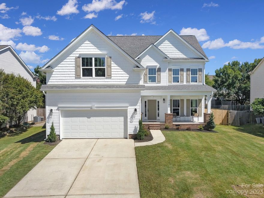 Rare opportunity to own new construction in established Laurel Meadow neighborhood! Incredible Fort Mill location with easy access to I-77, I-485, & RiverGate! This well-curated home features engineered hardwoods, neutral color palette, and designer fixtures & finishes throughout! Downstairs features open-concept living & dining spaces adjacent to show-stopping kitchen featuring carrara quartz countertops, breakfast bar & stainless appliance package with range hood. Additional flex space (perfect for formal dining room or home office), laundry/mudroom & powder room round out the main floor. Upstairs, you'll find the breathtaking primary suite with cathedral ceiling & walk-in closet with custom shelving. Ensuite bath boasts a soaker tub, large tiled shower with rainhead, & custom double vanity. Three secondary bedrooms, bed/bonus room over garage, and another full bath round out the upstairs. Large rear deck & fenced backyard, covered front porch, and two car garage! This is the one!