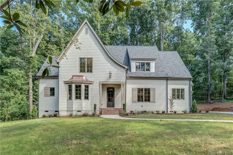 Beautiful new custom home in Cotswold built by Halley Douglas Homes! This home has it all: designer kitchen with scullery, open layout, luxury master suite,beautiful moldings,drop zone, covered porch, and side entry garage. First floor has office/guest room with adjacent full bath, 3rd floor has a bonus room with bed and bath. All of this on over 1/2 acre private wooded lot. Desirable Myers Park Schools. Several other high end custom homes being built in the neighborhood.