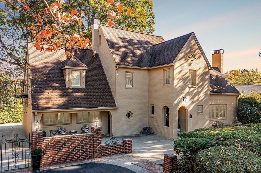 Beautifully Renovated & Meticulously Maintained historic home, positioned on nearly 1 acre, private, level lot! With all the original charm & character, this gem boasts so much pride & integrity throughout w/plenty of millwork, archways including arched front door & arched, interior French Doors, high, vaulted ceilings, custom built in book cabinets/shelving, chandeliers, beautiful fireplace mantels & hardwood flooring! Main floor offers spacious living spaces & nice natural light! Fresh paint including trimwork & updated light fixtures throughout majority of home! Primary Bedroom on main features completely revonated private Bath & electric fireplace! Wall removed between Kitchen & Dining Room to open up space! Impressive, private back yard w/lush landscaping, raised beds for gardens & covered porch & wrap around patio, perfect for entertaining or relaxing & enjoying your beautiful property! 2 fire pits! Detached, 2 car, carport w/workshop (280 sq ft w/electricity)! Generac Generator!