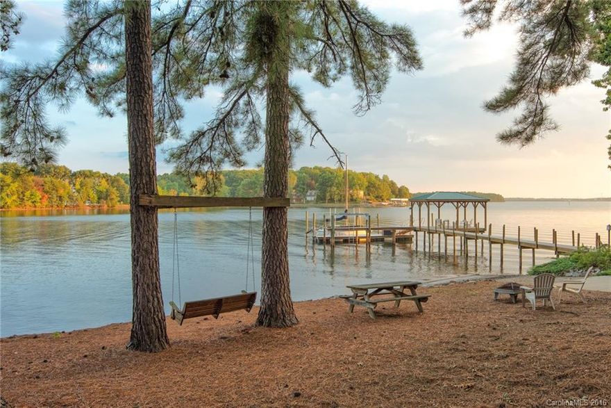 Peaceful Lake Norman waterfront setting in the premier Upper Jetton area features 200+/- ft of shoreline & private beach to enjoy gorgeous sunsets. Post & beam style home has finished daylight basement & offers warm wood finishes, expansive windows & wrapping deck. Kitchen with granite & stainless appl. Lakeside master has private deck. Newer pier with covered sitting area, 6,000 lb lift & boat ramp. Highly desirable location amid multi-million dollar upscale homes just 30 min from Charlotte.