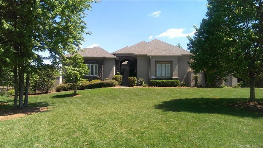 This gorgeous home is located on exciting Lake Norman with a fantastic view and pier/boat slip!  There is also a private yard with private pool and jacuzzi. Features include a 3 car garage, open floor plan, finished basement, first floor bedroom, and media room. Kitchen has all the extras with breakfast bar, kitchen island, stainless steel appliances, double ovens, and walk in pantry. The master bedroom has 2 master closets and the master bathroom has dual sinks, garden tub, and separate shower.