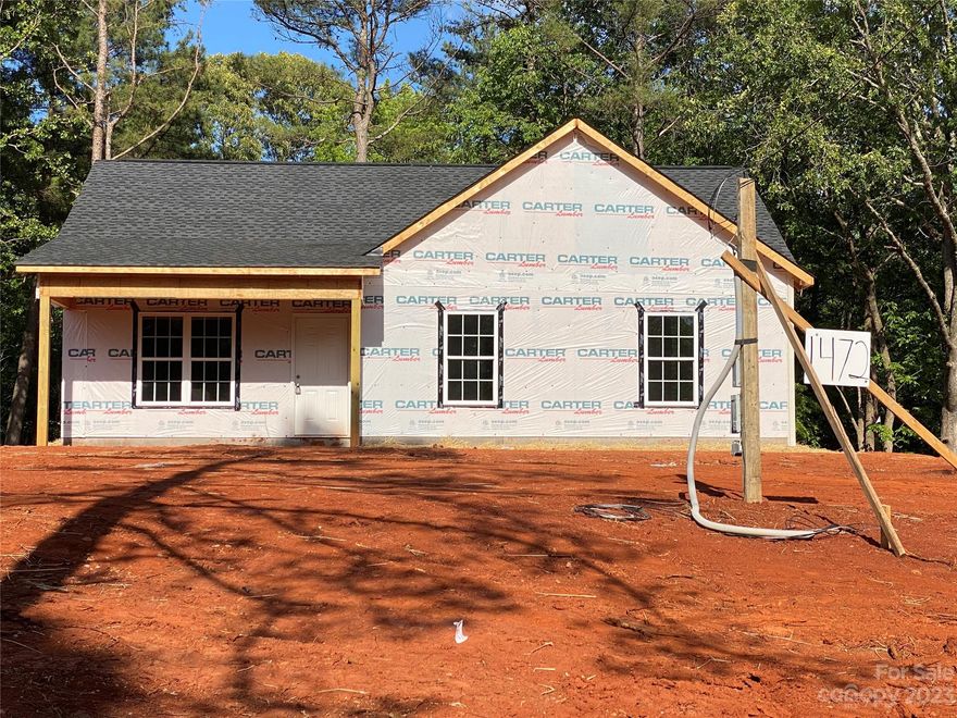 Quality new construction home convenient to town, yet still feels like country life. This home features three bedrooms and two full baths, situated on a large 1.3-acre lot. The selections will include custom wood natural finish cabinets, granite countertops, brushed nickel fixtures, luxury vinyl plank flooring, and on-trend repose gray walls. This darling home won't last long! 

note: the photo is a rendering only, colors/selections will be different.