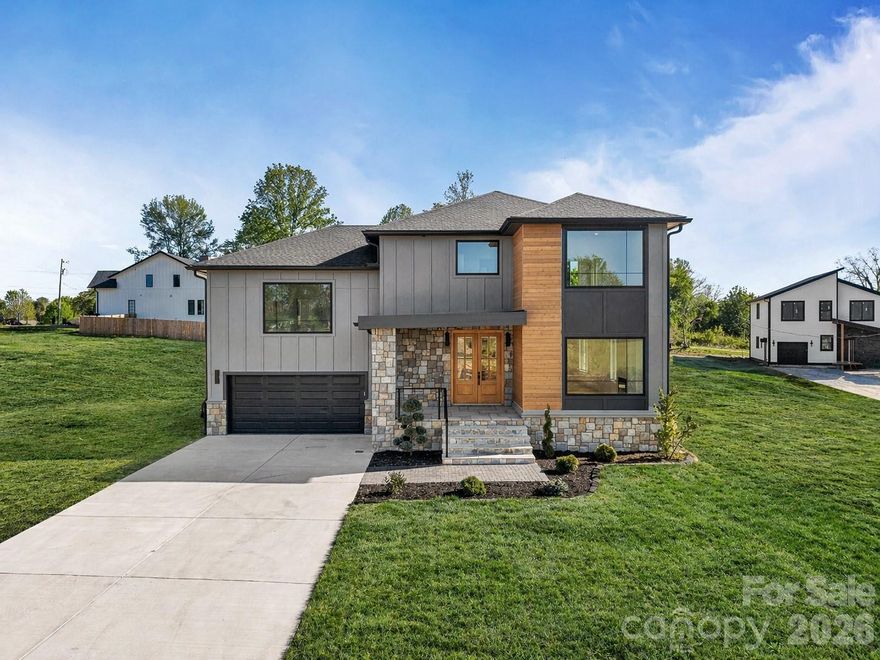 Experience modern luxury living in this new construction home, thoughtfully designed for both style and functionality. From the moment you step inside, you're welcomed by an abundance of natural light flowing in from the expansive windows, showing off the open floor plan, and contemporary high-end finishes.  

The chef's kitchen is a true centerpiece, featuring white oak cabinetry with custom insert detailing, an island with bar seating, and high-end appliances-perfect for entertaining and everyday living. Enjoy cozy evenings by the fireplace or step outside to the covered back deck- ideal for grilling, relaxing, and entertaining year-round.

The Primary suite is a private retreat, set apart on it's own level with ultimate privacy. With impressive 10-foot ceilings and a spacious layout.The spa-inspired bathroom showcases a large walk-in shower, a freestanding soaking tub, and a separate enclosed toilet, while the oversized walk-in closet provides exceptional storage.

This 2,418 sq ft home features 3 bedrooms plus a versatile bonus room, offering flexible space for guests, a home office, or additional living area. Enjoy the freedom of no HOA while being conveniently located just minutes from dinning, shopping, and everything the town has to offer. A true investment opportunity- offering potential for Airbnb and short-term rental use.