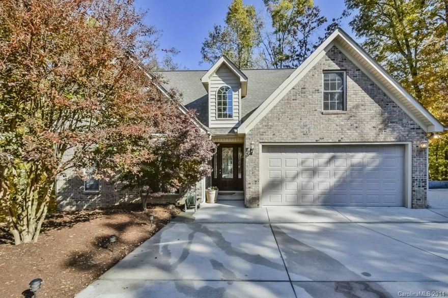 Wow! Your own private wooded retreat nestled on a cul-de-sac by the lake in amenity rich 
neighborhood with award wining schools &priced to sell! Gorgeous Custom with Master on
main, airy open plan, HUGE light filed Bonus/Bedroom. Amazing Lower Level rec room with 
Guest Suite, wet bar, & covered porch –2nd living quarters? Granite, beautiful cabinetry, 
architectural details, hardwoods throughout main level, 2 fireplaces! Fabulous storage 
throughout.