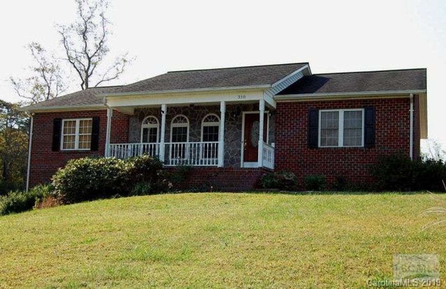 Immaculately maintained, 3BR/3BA brick home located on an acre in beautiful country setting. Large in-ground pool and slide completely fenced. Enjoy wonderful outdoor areas featuring multi-tiered and covered deck.  Covered front porch provides pastoral views.  Mature landscaping with many blooming perennials.  Bright, open living, kitchen and dining areas feature vaulted ceilings and beautiful hardwood floors. Beautiful kitchen features chef's island and beautiful cabinetry. French doors open from kitchen to covered deck-great for entertaining. Spacious master suite features large walk-in closet, large bath featuring unique fixtures and tile accents. Laundry room has additional storage.  Large family/multi-media room on lower level has an additional full bath with shower/tub combo. Large closets and storage space throughout.  Gas line in family room could be used for the addition of a stove or gas logs.  Double car garage has built-in workshop shelves and storage.