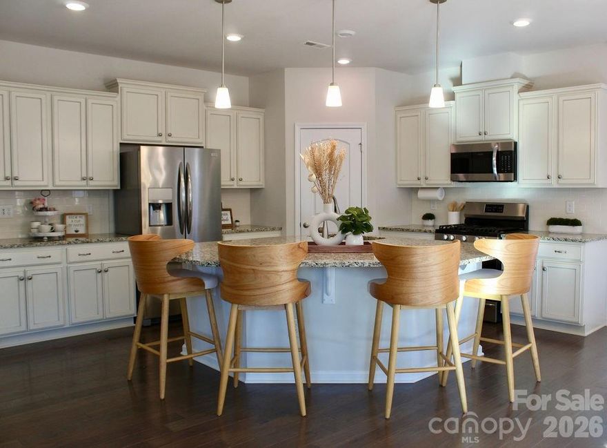 ***Seller offering TWO YEARS OF HOA DUES paid at closing with an acceptable offer - an amazing opportunity to enjoy the lifestyle from day one with immediate savings for 24 months.

Some communities are built to impress. Others are built to connect. Imagery at Mountain Island Lake strikes a thoughtful balance - large enough to offer an impressive range of amenities and activities, yet intentionally designed so neighbors recognize one another and friendships form naturally. With a full calendar of events led by an on-site lifestyle director, there’s always something happening, and plenty of opportunities to participate without feeling crowded or overlooked.

Here, it’s easy to see familiar faces at fitness classes, social gatherings, or around the clubhouse. Shared meals happen often, and connections grow over time - creating an atmosphere that feels active, welcoming, and genuinely engaging.

This well-positioned home sits just a short walk from the community’s amenities and scenic lake walking trails, making it simple to stay involved. Whether it’s a morning walk, pickleball match, group class, or evening with friends, everyday feels like a vacation.

The one-story floorplan offers comfortable, low-maintenance living on a generously sized homesite, allowing for added privacy and space to relax. A private backyard - with an oversized screened porch, stone patio, and gas fireplace - provides the perfect setting for morning coffee or casual get-togethers.

If you’re ready to start your next chapter, and are seeking a vibrant 55+ community that offers variety without overwhelm, connection without congestion, and an active lifestyle that still feels personal, then this home is your  opportunity - made even more compelling with two years of HOA dues included with an acceptable offer.