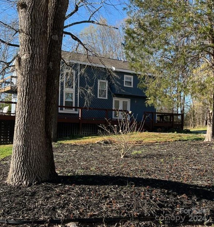 Want to come home to complete quite and relaxation then I have the place for you.  Follow the long driveway to your little piece of paradise.  Sit on the wrap around deck and watch the sunset or wildlife and let your cares melt away.  There is a beautiful pond on the property to go for picnics or fishing and lots of room on the 25 acres to ride the 4 wheelers. This is country at its best.  Inside you will be impressed with the open floor plan that is just perfect for those big family get togethers or just entertaining your friends.  The basement can be anything you want with 2 big bonus areas and tons of storage and a full bath with laundry hook ups .  The basement goes out into a screened in area great for kids to play in.  All this home needs is a little love and your family to make it complete.  Come check this property out before it gone.