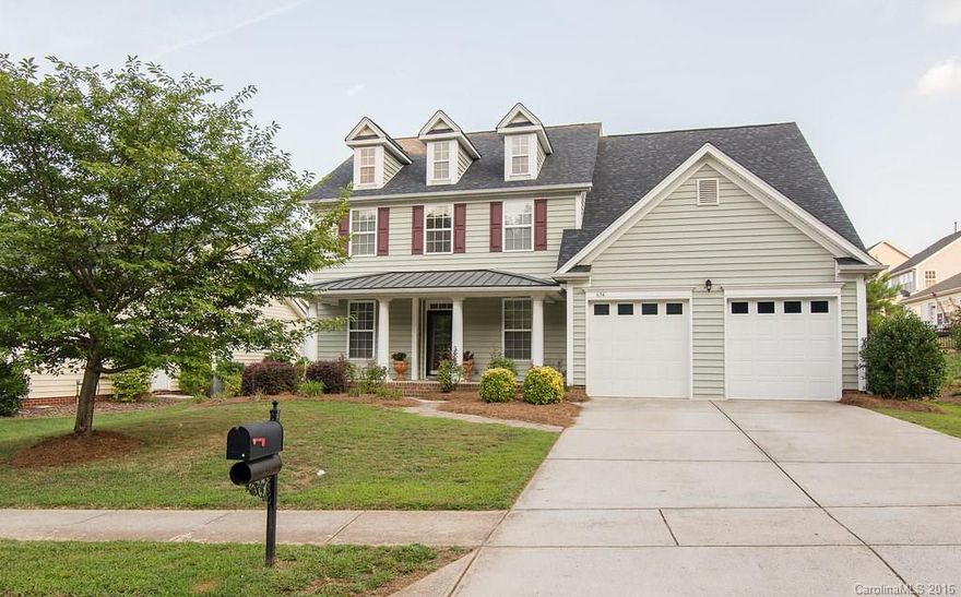 This beautiful, huge home features all of the upgrades!  Great open floor plan with cathedral ceilings, a large butlers pantry between the kitchen and formal dining room.  Granite countertops, ceramic tile, hardwood floors, new carpet, home office, intercom system, master on main, sitting room off of the living room, fenced in back yard.  Within walking distance to the neighborhood pool, play area, shops, gym and restaurants.