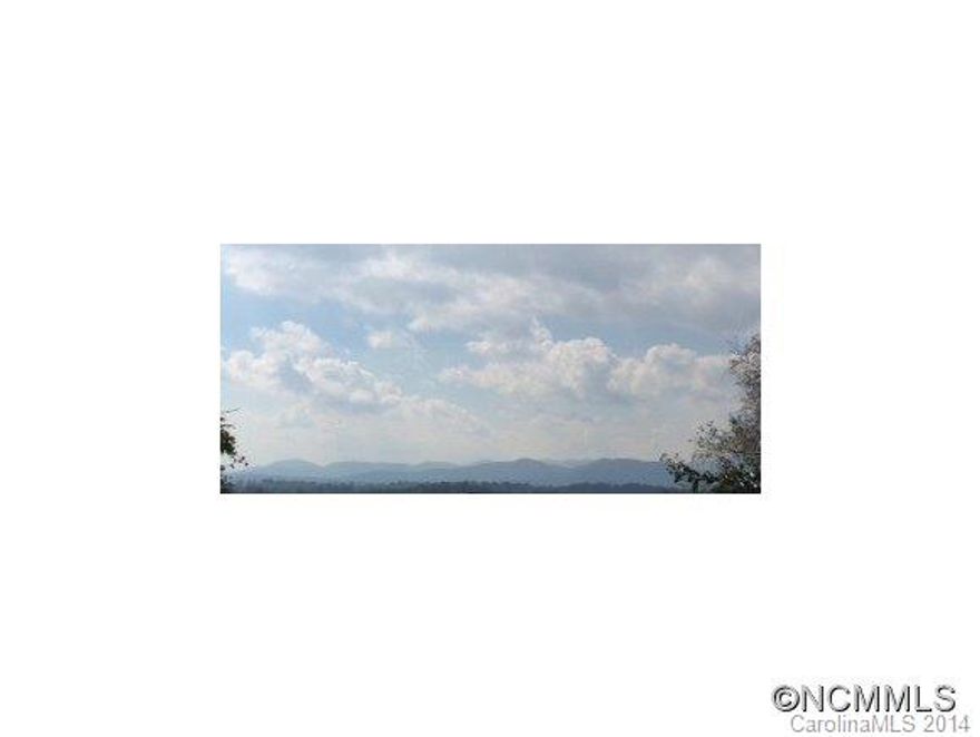Great Location 6 mins from downtown Asheville. Property has long range views to the west. Flexible building allowed. City water and Sewer. Abuts Eliada Home property.