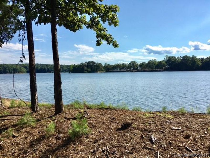 Lot #285 is one of the largest (.73 acres) waterfront lots in Reflection Pointe. Stunning waterfront sunset views from this property! Point lot has main channel, South Fork and cove views all in one!  Entire 315 feet waterfront has been shore stabilized with rip rap. Gentle sloping lot.
Lot #286 is also listed on MLS for sale (same owner).
Please look under attachments for a Plat map of this lot.