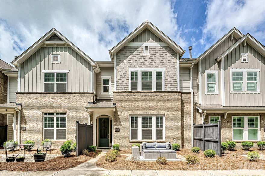 This contemporary townhome offers spaciousness, modern design and a layout for contemporary living.  The open-concept main level centers around a gourmet kitchen with oversized island, wall oven and microwave, gas range with hood vent, and stylish cabinetry that blends function with form.  The open-concept kitchen overlooks the dining and living areas creating the ideal entertaining space.  Upstairs, a versatile loft offers added flexibility.  The expansive primary suite is a standout, complete with a spa-like bath and generous closet space.  The attached two-car garage provides both functionality and storage.  Located just minutes from Ballantyne, the new Ballantyne Bowl with fabulous dining, entertainment center, shopping and so much more!  The community of Southridge combines comfort, style, and an unbeatable location. Explore this fantastic townhome with unbeatable location with 4 beds total with a full bed and bath on main!
