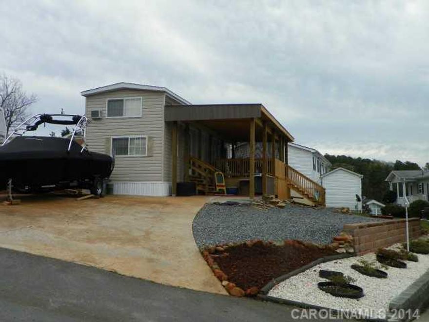 Beautiful 2014 Park Model with double loft area, beautiful interior,SS appliances,Covered porch with great lake view,covered grilling area. Park Model situated on a concrete pad, concrete parking & gravel.Nicely landscaped.    Tax value is for lot only.