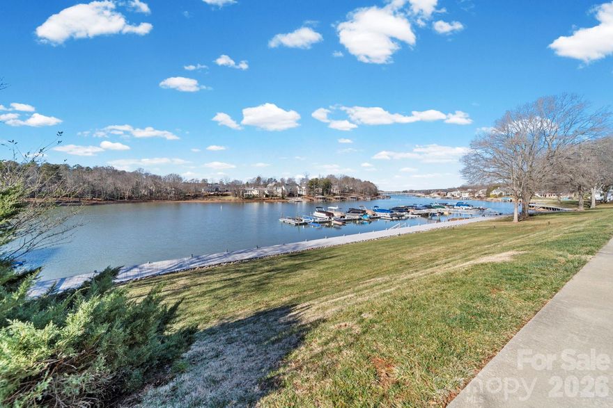 Welcome to refined lakefront living on Lake Norman at 529 Catspaw Road. This elegant three-story end-unit townhome offers sweeping water views from every level and effortless lake access, boat slip**, blending upscale comfort with the relaxed luxury of waterfront life. An oversized deck provides the perfect setting to take in panoramic lake views, entertain guests, or unwind as the sun sets over the water.
The main level features a beautifully appointed kitchen with tile flooring and updated stainless steel appliances, including a beverage refrigerator, double-door kitchen refrigerator, double convection oven, and over the stove microwave. The living room is designed for both comfort and entertaining, showcasing LVP flooring, plantation shutters, a striking stone gas-log fireplace, and a full wet bar—all framed by stunning lake views.
Upstairs, you’ll find three bedrooms and two full bathrooms, including a spacious primary suite with a walk-in closet, dual bathroom vanities, tile flooring in bath, and a private balcony overlooking the lake for a peaceful retreat to start or end your day.
The walk-out lower level adds exceptional versatility with a flex space, additional bedroom, full bathroom, laundry room, and direct access to a covered outdoor area leading to the new dock and boat lift. A convenient laundry chute connects the upper level to the  basement for added ease. With four bedrooms and three-and-a-half bathrooms, the home offers plenty of space for guests, a home office, or full-time lake living.
Additional highlights include an oversized water heater, all new high-rise toilets throughout, a $22,000 special assessment already paid for the dock replacement, and a newer boat lift.
Enjoy breathtaking views, thoughtful upgrades, and the added privacy of an end unit—this is Lake Norman living at its finest.
This building has a structural defect from when it was built that has caused a rise in the dining room floor.  Seller has noted no change in this in years.**Boat slip is NOT deeded is assigned by HOA**