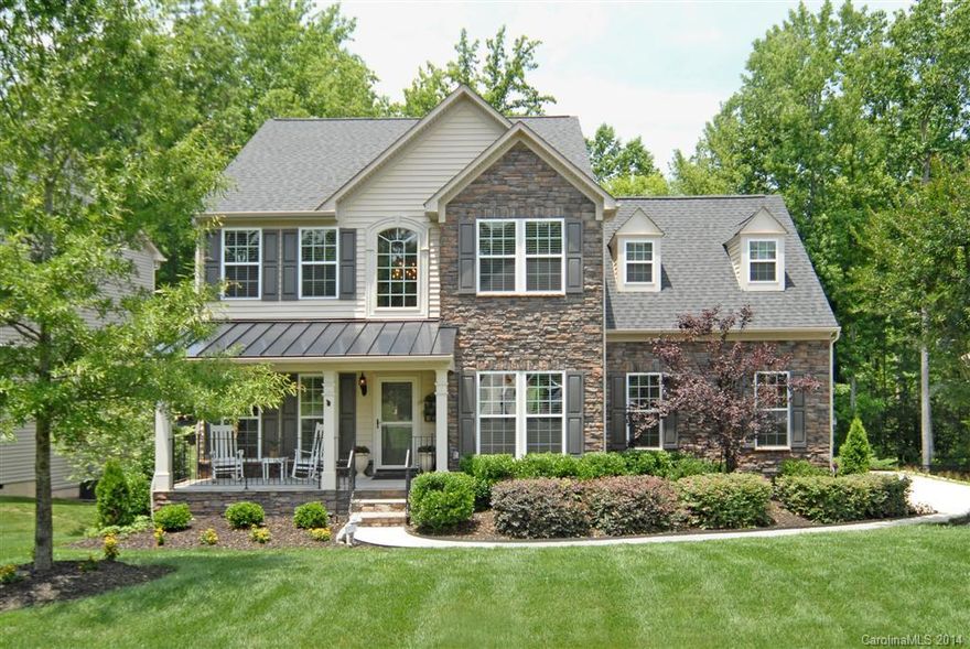 Beautiful spacious home w/ full walkout basement on landscaped wooded lot in popular Lake Wylie neighborhood. Rocking chair front porch. 2 story foyer, office with french doors, Kitchen w/ 5 burner gas cook top, double oven, glass tile back splash & breakfast area. 2 Fireplaces. Morning room off kitchen w/access to upper deck. Mstr bdrm has 2 walk-in closets, trey ceiling. Basement has family room with fireplace, game room, game nook. Great for entertaining or relaxing. Covered & open patio.