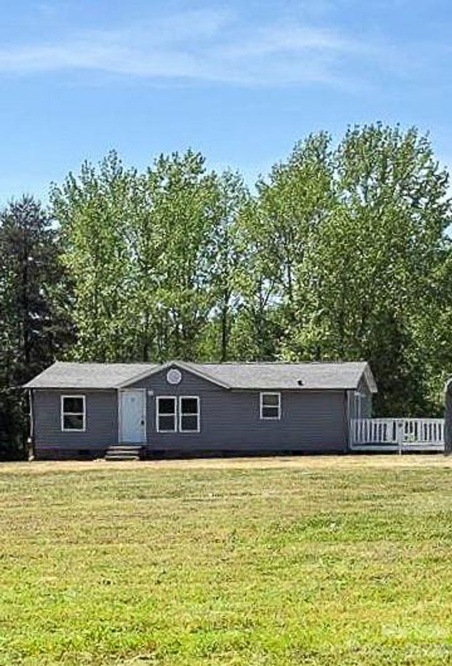 Equestrian property with  9 acres some fenced.  2 barns, one with room to park tractors etc and 4-5 stalls with tack room and huge hay loft.  Mobile home on property needs work but could be remodeled or torn down and build your dream home facing pond.  Pond is shared with neighbor but homes are not close to each other.  If you are looking for a place to keep your horses or start a boarding facility this is your start.  Come experience the peaceful feeling of living in the country and imagine the things you can enjoy with your family and friends.