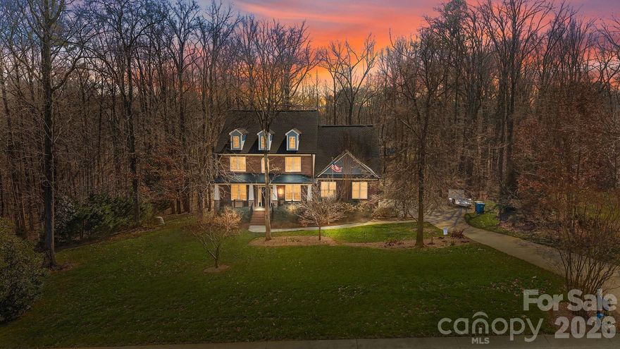 Tucked at the end of a quiet cul-de-sac on 1.22 wooded acres, this all-brick home offers the kind of privacy that’s increasingly difficult to find in Mint Hill.

With over 4,100 heated square feet across three finished levels, the home gives everyone room to spread out without feeling disconnected. The main level includes a dedicated office and formal dining room, along with comfortable living spaces designed for everyday use. Upstairs, the oversized bonus room functions well as a private suite. The finished basement, complete with a full bath, adds additional space for guests, recreation, or extended living.

The rear deck overlooks mature trees and natural surroundings, creating a peaceful backdrop just minutes from I-485, shopping, and dining. A whole-house standby generator, private well, and oversized 3-car side-load garage add practical value to this solidly built 2008 home.