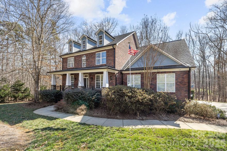 Tucked at the end of a quiet cul-de-sac on 1.22 wooded acres, this all-brick home offers the kind of privacy that’s increasingly difficult to find in Mint Hill.

With over 4,100 heated square feet across three finished levels, the home gives everyone room to spread out without feeling disconnected. The main level includes a dedicated office and formal dining room, along with comfortable living spaces designed for everyday use. Upstairs, the oversized bonus room functions well as a private suite. The finished basement, complete with a full bath, adds additional space for guests, recreation, or extended living.

The rear deck overlooks mature trees and natural surroundings, creating a peaceful backdrop just minutes from I-485, shopping, and dining. A whole-house standby generator, private well, and oversized 3-car side-load garage add practical value to this solidly built 2008 home.