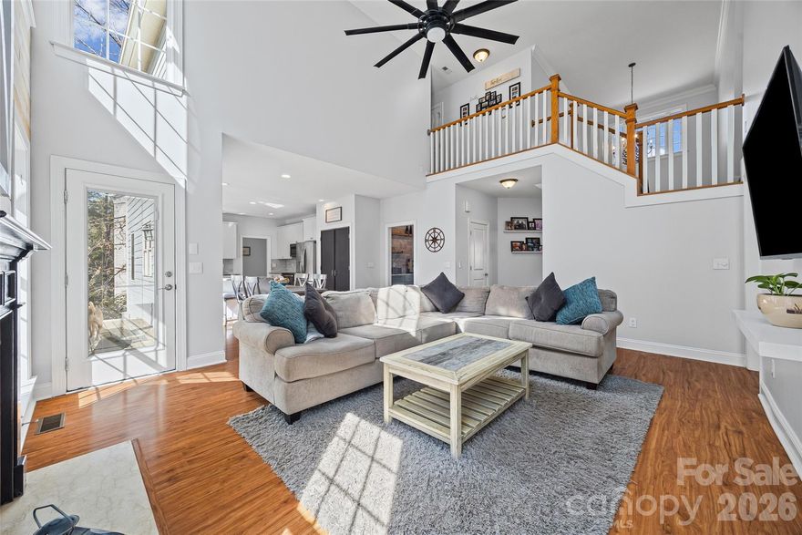 Welcome Home to this beautifully updated 5-bedroom, 4.5-bath home on a peaceful cul-de-sac lot. This well-maintained home on the Tega Cay peninsula offers everything with no HOA restrictions and award-winning Fort Mill Schools. From the inviting front porch, step inside the grand two-story foyer. The main level features a large office with built in desks and cabinets and a spacious dining room. The remodeled kitchen is a chef’s dream, complete with double ovens, ample counter space and a large open layout perfect for cooking and entertaining. Anchored by a spacious breakfast bar, the kitchen flows effortlessly into the breakfast area and the two-story family room which impresses with soaring ceilings, abundant natural light and a cozy gas fireplace. The main level also includes the laundry room and a bedroom ideal for visitors or extended family. Upstairs, the primary suite offers a tray ceiling and spa-like ensuite which features a frameless glass shower, dual vanities, and a soaking tub. Two additional bedrooms share a Jack-and-Jill bath, and the upper level is completed by a 4th bedroom/bonus room. The finished walk-out basement could function as a secondary living space with a flex room, full bathroom, abundant storage, and large utility room with laundry hook ups. A full kitchen with bar seating features a gas stove, wine fridge and beer taps! The built-in sauna and an impressive fully set-up theater room make the perfect retreat for fun or relaxation! It’s the perfect setup for multigenerational living, guests or unforgettable entertainment. Outdoors, escape to your own private resort-style backyard ideal for entertaining or relaxing. You’ll find a heated saltwater pool with tranquil waterfalls and tanning ledge, relaxing hot tub, outdoor bathroom, expansive paver patio, deck, porch, sand fire pit area and surrounding green space all on a large 1/2 acre lot. This home is truly move-in ready. The location is unbeatable, only minutes from shopping, restaurants, hospitals, schools, and major highways. Tega Cay offers endless recreational amenities including golf, tennis, pickleball, and lake access. This home is just a short commute to Charlotte, Rock Hill, Ballantyne & more! Don't miss your chance to own this home!