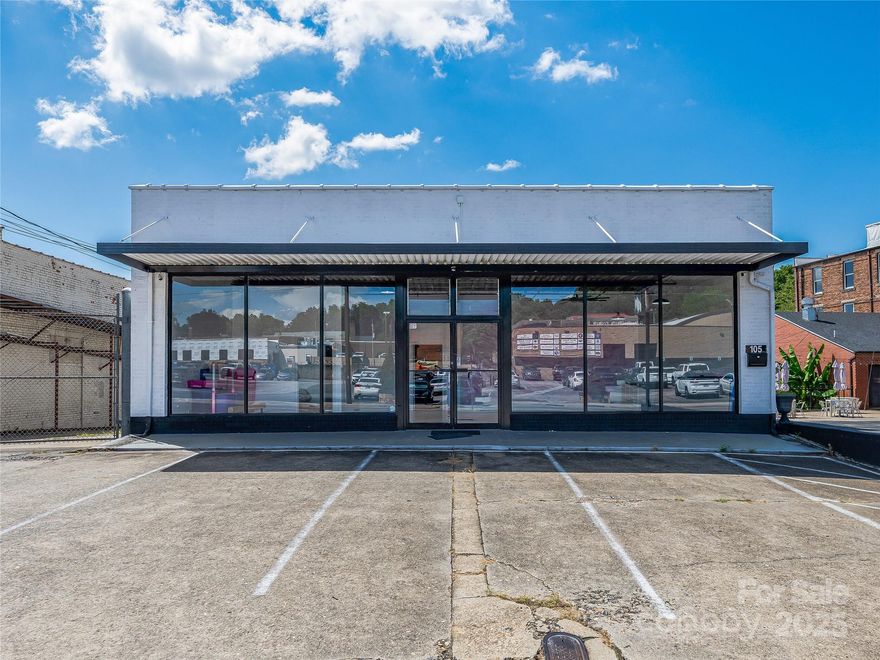 Own a piece of downtown Marion with this freestanding, well maintained and updated 7,645 SF commercial building located at 105 West Henderson Street. Zoned C-1 and situated on a high-visibility corridor with 57 feet of road frontage and 19,000 vehicles per day, this property includes dedicated parking in the front and public parking is available nearby. The building features a full, heated and cooled unfinished basement with a roll-up door, offering flexible space for storage, studio, or workshop use. Previously home to a dance school, the layout is ideal for retail, office, fitness, or creative use. Located within the Marion Social District, home to the Bigfoot Festival and surrounded by downtown favorites like Ingenious Coffee, Refinery 13, Mica Town Brewing, the Marion Tailgate Market, and  Marion Business Complex that houses +/- 20 small businesses. Just 4 miles from I-40, this location combines charm, visibility, and accessibility in a thriving Western North Carolina community.