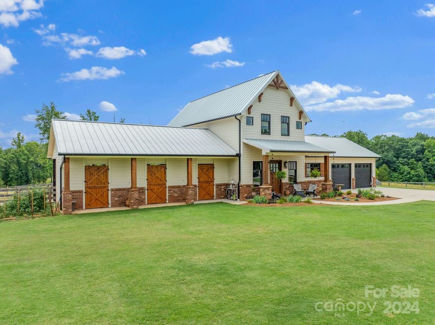 EQUESTRIAN DREAM COME TRUE! 17 acres horse farm built in 2022, with a gorgeous home and barn, fencing, outbuildings, 5 paddocks, round pen, and run in sheds. Located in the heart of the GENTS trail system and Tryon Hounds Hunting Country. Custom built home with attached 3 stall barn, 2 car garage, 30' x 36' separate garage/workshop with tons of storage. Quality finishes include ship lap walls, antique brick features, 100% custom kitchen cabinets, granite countertops, high grade appliances, solid oak floors with oil rub finish, and even a hydraulic elevator. Primary suite with huge master bath, walk in closet, laundry, screened porch with mountain views. Generac generator, central vacuum, smart house system, security system, metal roof, cement board siding and shingles, buried irrigation. 12' x 12' stalls, wash rack w hot & cold water, tack room, silo for hay storage. Gated entrance. Absolutely turnkey property and the quality of the finishes in the house will thrill you!