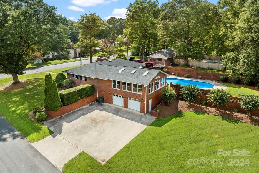 Wonderful brick ranch. 3 bedrooms, 3 full baths. Large kitchen with plenty of countertop space & dining area leading out to a nice deck/patio area overlooking the pool perfect for having early morning coffee. Huge sunroom/den for gatherings. You will love this large lot with landscaped back yard with plenty of decking & patio areas. Nice inground pool for hot summer days. This home is great for entertaining & relaxing. Also features basement/workshop area, storage room & oversized 2 car garage. Minutes from 321 & easy access to I-85. Don't miss out on this one!