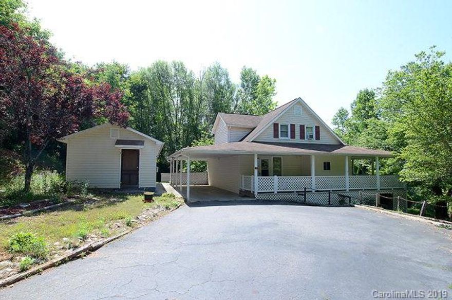 Price Reduction! Great property in the desirable Glenwood Community!  This 1,894 square foot home offers 3 bedrooms, 2 full baths, dining room and downstairs den.  There is an additional room upstairs that can be used as an office or another bedroom if needed.  Original hardwood floors are under the carpet in the entire house!  There is a 40x14 outbuilding that is half workshop/finished office that could be used for numerous projects!  All this and 2.85 acres.... Enjoy all this from the beautiful wrap around porch!