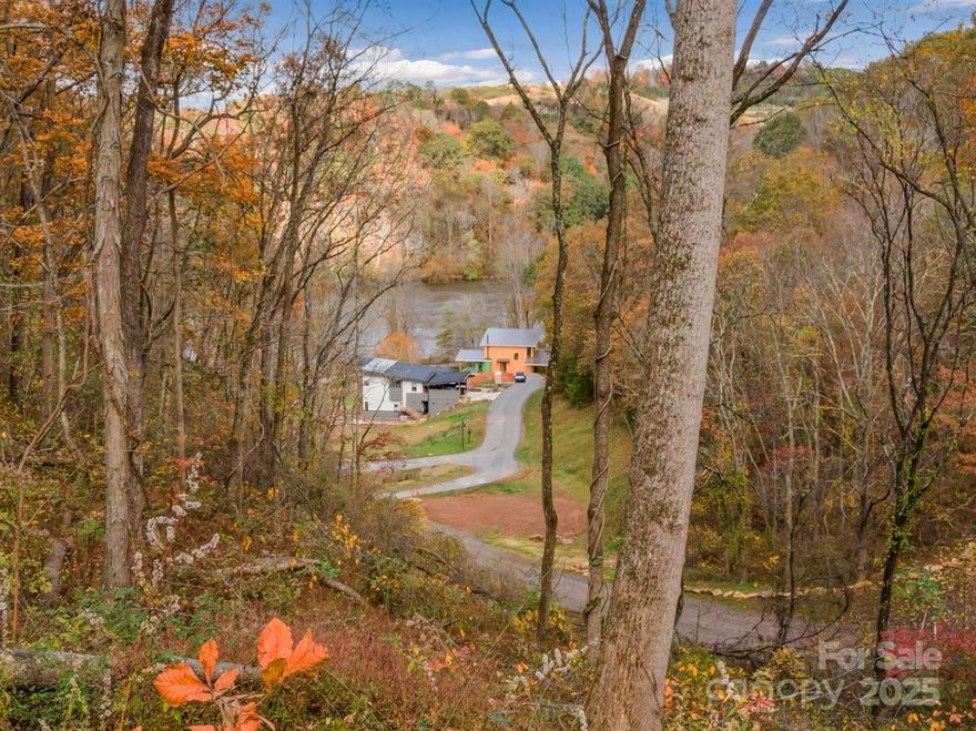 The only riverfront lot currently available at Olivette! This premier homesite offers direct access to the French Broad River in Asheville’s nationally recognized agrihood—just 6.9 miles from downtown. Olivette is a 411-acre planned community centered around a year-round organic farm and designed with nature, food, and community at its heart. Residents enjoy access to a private river island with pavilion and fire pit, a riverfront park, miles of trails, edible landscapes, community gardens, an amphitheater, labyrinth, and more. Enjoy fiber optic internet, underground utilities, city water/sewer, and state-maintained roads—all while living in a truly one-of-a-kind setting. Lot 30 is a rare chance to build your dream home right on the river in one of Asheville’s most sought-after lifestyle communities. As featured in Martha Stewart Living, Olivette is where beauty, sustainability, and connection come home.