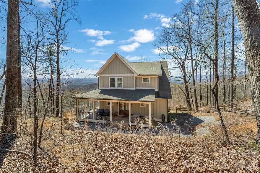 Commanding the summit of Pinnacle Mountain, this exceptional 2022 modern farmhouse delivers truly breathtaking, long-range mountain views across 4.29 private acres. Designed to impress and built for elevated living, this 4-bedroom, 3.5-bath retreat seamlessly blends refined craftsmanship, modern comfort, and awe-inspiring natural beauty. The open-concept main level stuns with soaring vaulted ceilings, rich hardwood floors, a wood-burning fireplace, and walls of windows that frame endless layers of mountain vistas. The designer kitchen features stainless steel appliances, granite countertops, and effortless flow into the living and dining spaces—perfect for entertaining or simply taking in the views. The main-level primary suite is a serene escape with a walk-in closet, spa-inspired ensuite bath, and private access to the back deck where the scenery stretches for miles. Upstairs, two spacious guest bedrooms, a full bath, and ample storage provide comfort and flexibility. The finished lower level expands the home’s versatility with a large recreation room opening to a view-filled patio, along with a fourth bedroom and full bath—ideal for guests or multigenerational living. Offered fully furnished within a gated community, this home is perfectly suited for lock-and-leave convenience or short-term rentals. Convenient to Chimney Rock, Lake Lure, Marion, and an easy drive to Asheville via I-40, this rare mountaintop offering combines privacy, tranquility, and unforgettable views—an extraordinary opportunity to own a true piece of the mountains.