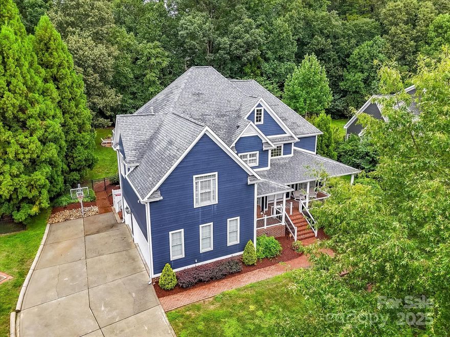 Experience luxury living in the heart of River Run with this Stunning, 6 Bedroom, 5.5 Bath Home located on half acre, private lot in historic Davidson! Grand, double door entry, thoughtful, high end finishes & upgrades, plantation shutters & an oasis style salt water (heated) pool/spa! Remodeled (2021) Chef's Kitchen is a showstopper offering quartz counters, large island, premium, stainless steel appliances, double wall oven, gas cook top, hood system, tile back splash, pot filler, breakfast bar & ample cabinetry for storage! Formal Dining Room features gas fireplace & deep tray ceiling! Inviting Family Room with cozy electric fireplace! Main level includes private guest suite with ensuite bath! Upper level Owner's Retreat boasts double tray ceiling, sitting area with gas fireplace & huge, breathtaking, designer walk in closet! 3 additional spacious bedrooms & Office/Sitting Area on upper level as well as 2 convenient Laundry Rooms (main & upper level) complete this fabulous layout!