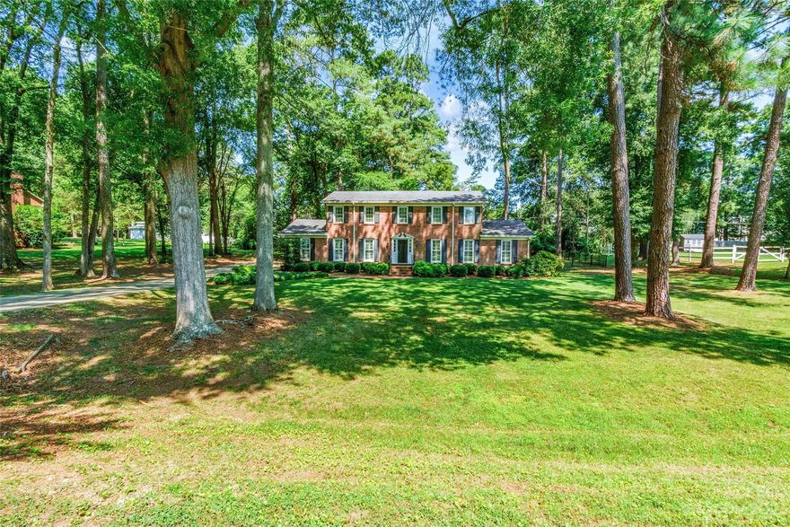 Stately full brick two story home with so much character and charm. Nearly an acre in desirable Meadow Lakes. Traditional floorplan with formal living and dining room that can also serve as home office or other purposes.  Primary suite is spacious with dual walk in closets and primary bath offers tile surround shower with glass door, tile flooring and granite countertop vanity.  Updated powder room has new sink, toilet and plank wood wall. Private, wooded yard with beautiful landscape lighting to make your evenings spent in the yard enjoyable. Fence has 2 10' gates and new 10x16x 7 shed. 2 car side load has great storage area. New septic tank replaced in 2019, 220 v in garage. *Seller is giving $5,000 incentive towards buyers closing cost.