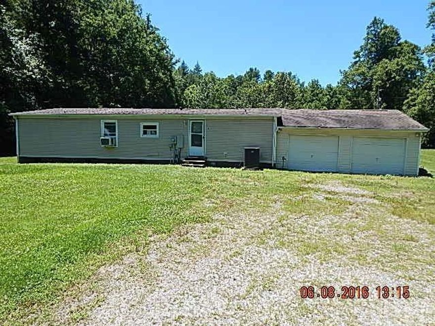 3br 2 ba Doublewide in fair condition with attached double garage. Lots of potential! Home needs some cosmetic repairs and updates and will also need a water source. Seller and or its agent make no representation to condition of property expressed and or implied. Home may be on a shared well, unable to find a shared well agreement and unable to confirm right of way, have found shared spring well agreement. Would advise all buyers to consult an attorney on these issues before making an offer. Sold as is. All offers need to be submitted via www.Realtybid.com PID#660714