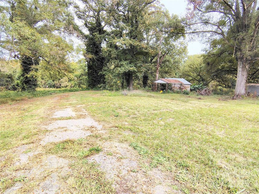 1.82 acres in downtown Cherryville ready to build your dream home or can be subdivided into 3 lots.  Two addresses exist for this parcel 500 & 502 N Mountain Street, 2 water taps & electricity exist on this property from previous structures, per the seller. 
Other uses allowed per zoning and/or special permit include up to 14 townhomes, up to 5 duplexes consisting of 2 units per structure, or a Bed & Breakfast.
Gaston County and City of Cherryville confirmed no minimum to build.  There is an old free-standing garage with lean-to on the property which has no value.
This is a great opportunity for an Investor/Builder or for someone to build a custom home.
Convenient to restaurants, schools, churches, shopping, & city park across from High School.
Note: William Beam Intermediate School is for grades 4 & 5.