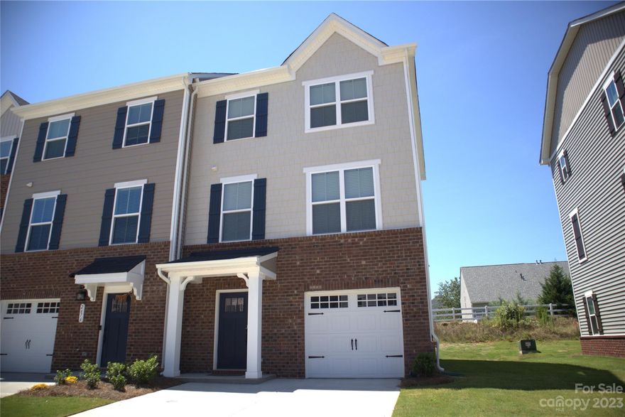 Charming 3 story 3 bedroom END UNIT townhome with 2 full-baths and 2 half baths in the heart of Fort Mill SC. This brand new property features a 1st floor with a convenient 1/2 bath in the entry way. This leads to a very large flex room that has double sliding doors which opens to a cozy backyard for relaxation. The 2nd floor also has a convenient 1/2 bath, open-floor style large living room and kitchen with island. A double sliding door opens from this kitchen to a large wooden deck. The 3rd floor houses a large master with tray ceiling and fan, master bath and walk-in closet. There are two other secondary bedrooms, another full bath and a laundry room for your convenience. Laminate wood floors throughout.
 With such a prime location, residents can enjoy the convenience of nearby amenities, schools, and parks. Ideal for families or individuals seeking comfort and accessibility in a friendly neighborhood. Don’t miss the chance to make this lovely townhouse your new home!
