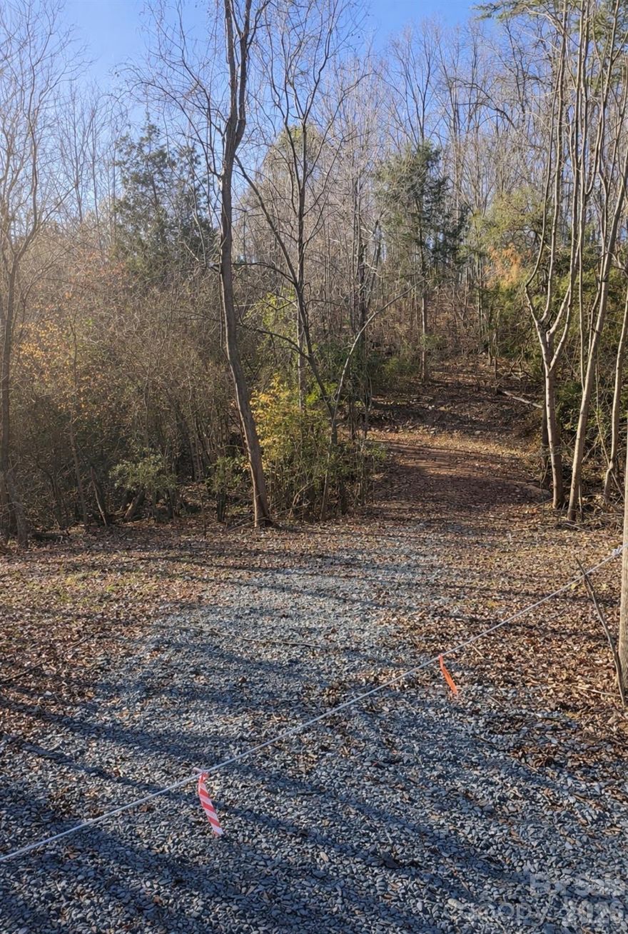 If you’ve been searching for space, privacy, and natural beauty, this 15-acre wooded property delivers it all. With a newly installed driveway, accessing and walking the land is easy, allowing you to fully experience its potential. Situated outside city limits, the setting feels like a mountain escape, complete with a creek at the lower end of the property. Whether you envision a secluded estate, a family compound, or multiple home sites, this land offers the freedom and flexibility to bring your vision to life.