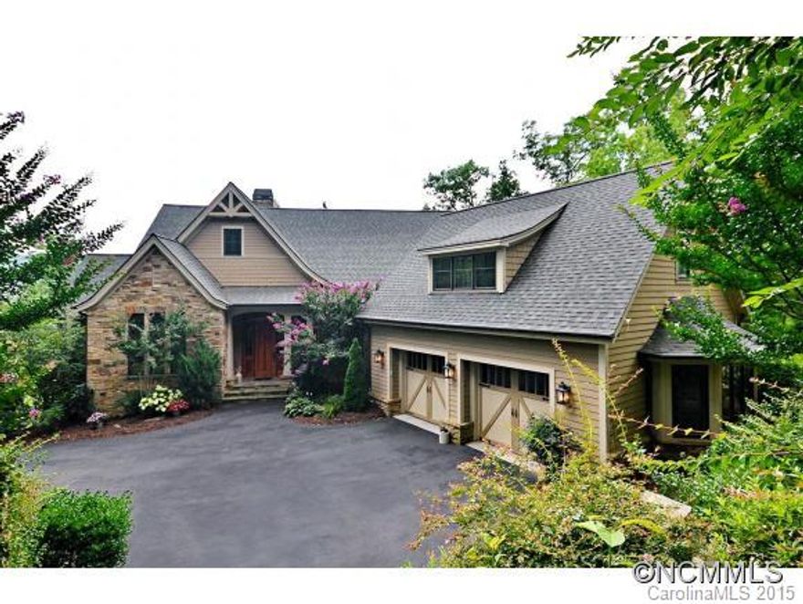 This is a great value in Walnut Cove. Open floor plan, walnut floors, upgraded appliances, newly added summer kitchen in the screened porch, decks on 2 levels. Mature landscaping and impeccably maintained. Easy to show this home and sell it!!  Agent must accompany!!