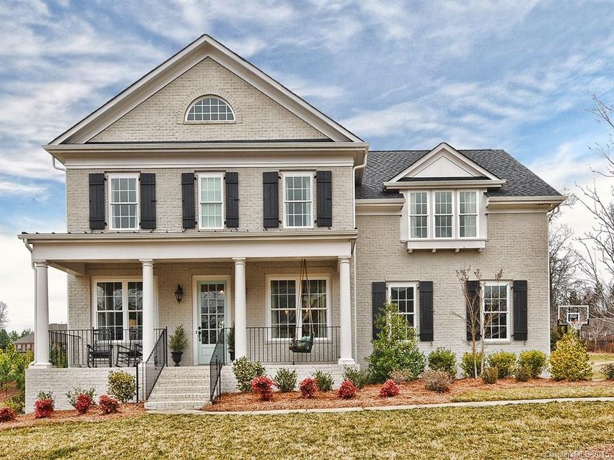 Full brick Charleston style home in amazing amenity rich BridgeMill. Perfect Southern Style w/front porch charm. 5BR/4BA around 3250 HSF. Bonus/media room up. It has amazing curb appeal. Lg yard, nearly 0.39 acre.  Gleaming hardwood floors. Chef's kitchen w/island & granite. John Wieland built in 2012.