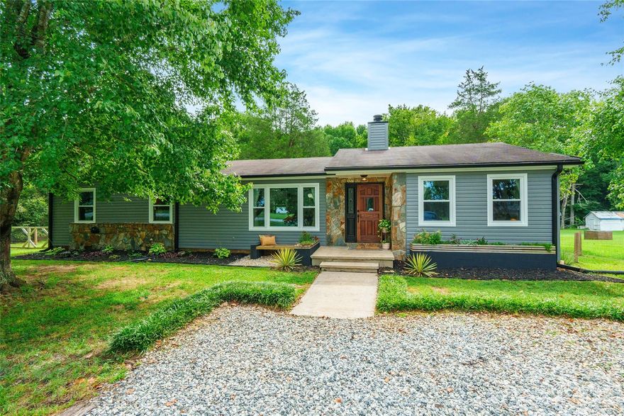 Stunning updated home with magazine-worthy landscaping! 4 bedrooms and 2 full baths. Open floor plan with beautiful new floors, fully remodeled kitchen with open shelving and new cabinets, and entertaining dining room that opens to the newer deck. Windows, gutters, and siding replaced 2023. Fenced large flat back yard with entertaining fire pit ready for the evenings. Unfinished basement perfect for a workshop, storage, or even extra entertaining space!