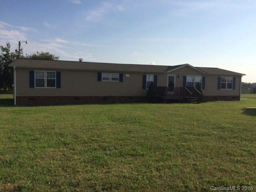 Spacious double wide with private yard, corner lot, large kitchen with dining room, rear deck, property in as is condition.