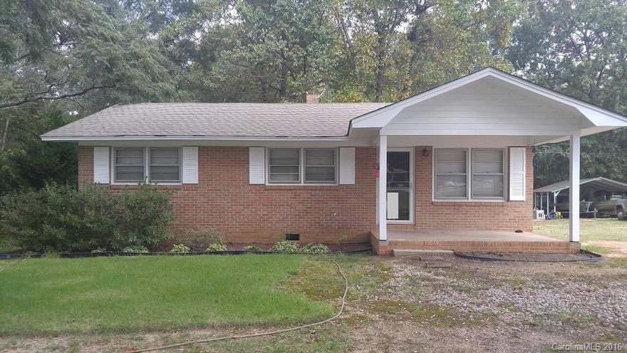Well maintained brick ranch home in the Lowrys Community of Chester County, SC.  Lowrys is a nice rural farming community with open spaces and local farmer's markets and events.  Large lot of 2+/- acres includes woods in back for privacy, and large lawn areas.  Newly remodeled kitchen open to breakfast area and living room.  Room used as 3rd bedroom has no closet.  Bath has tub/shower combo.  Two good size bedrooms end of hall.  Attic Stairs in hall.  Large utility/storage room on back.