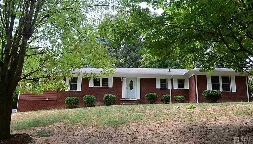 BEAUTIFULLY redone home with large lot that fronts on Maple and backs up to Beach St.  The basement is a separate living area w/2 bedrooms, living rm, kitchen and bath.--could be in-law apartment or rental possibility to help offset monthly house payment.  Main level has 3 bedrooms and 2 baths - practically everything is New-appliances, cabinets, flooring, paint and much more.  Hard to find two great living areas under one roof.